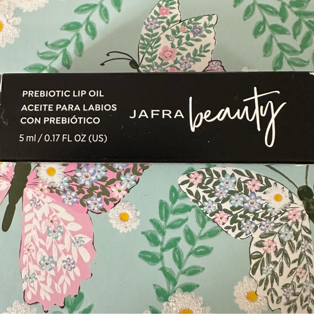 JAFRA Beauty Prebiotic Lip Oil in Black and Pink